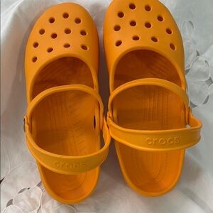 Woman’s Croc’s old style Mary Jane’s. 
Bright Orange. Both straps move.